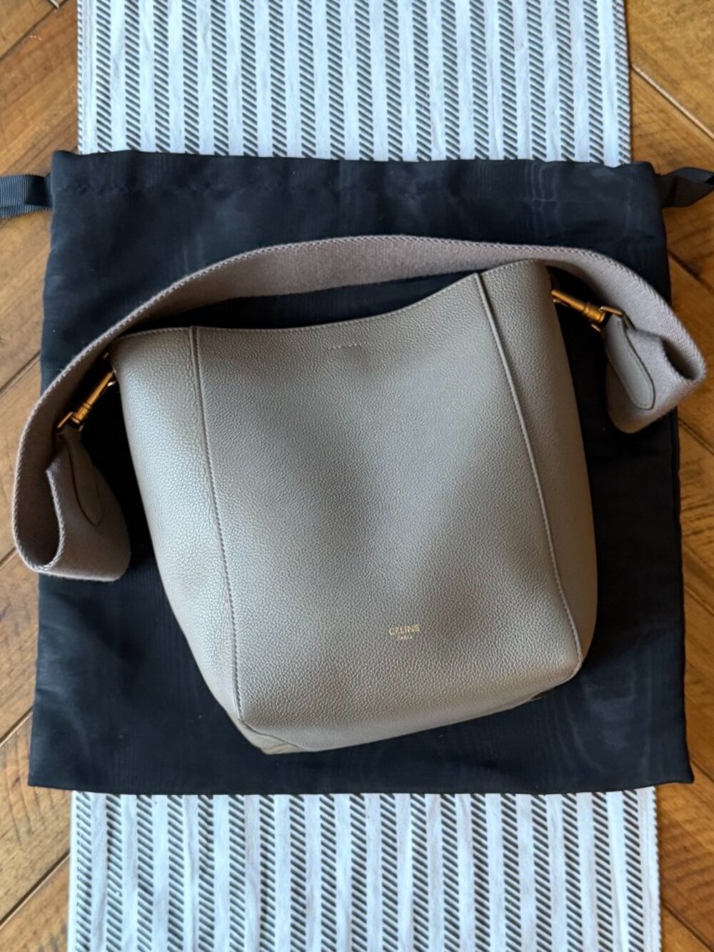 CELINE SOFT GRAINED CALFSKIN SMALL SANGLE BUCKET BAG IN TAUPE